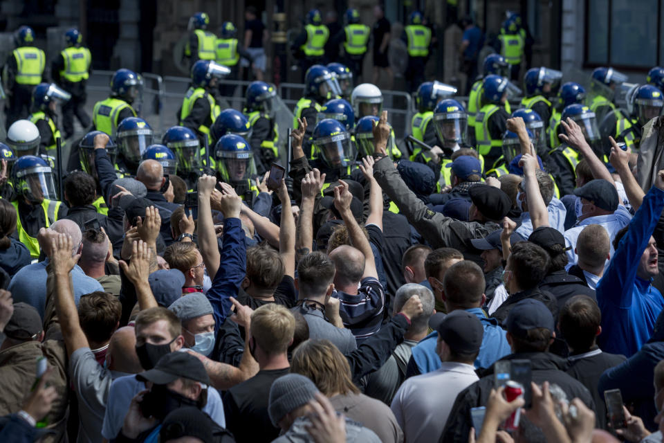 A week after a Black Lives Matter protest turned to violence when the statue of wartime Prime Minister Sir Winston Churchill was daubed in graffiti which called him a racist, and despite warning from police not to attend protests at all today - and to be off the streets by 5.00pm - a large group crowd of right-wing groups and veterans gathered at the boxed-in statue to 'protect it from further vandalism' by Black Lives Matter and anti-racism protesters. Riot police stopped the right-wing groups from proceeding up Whitehall where the Cenotaph was also behind a screen, resulting in scuffles, on 13th June 2020, in London, England. (Photo by Richard Baker / In Pictures via Getty Images)