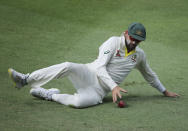 Australia's Nathan Lyon dives to catch the ball during their test match against Pakistanin Abu Dhabi, United Arab Emirates, Thursday, Oct. 18, 2018. (AP Photo/Kamran Jebreili)