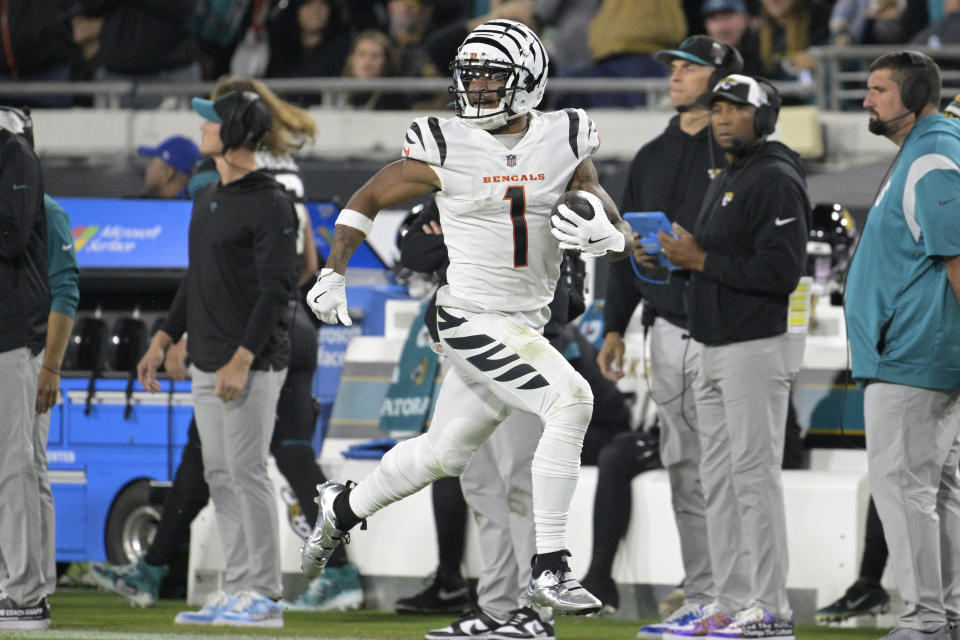 Cincinnati Bengals wide receiver Ja'Marr Chase (1) runs for a touchdown during the second half of an NFL football game against the Jacksonville Jaguars, Monday, Dec. 4, 2023, in Jacksonville, Fla. (AP Photo/Phelan M. Ebenhack)