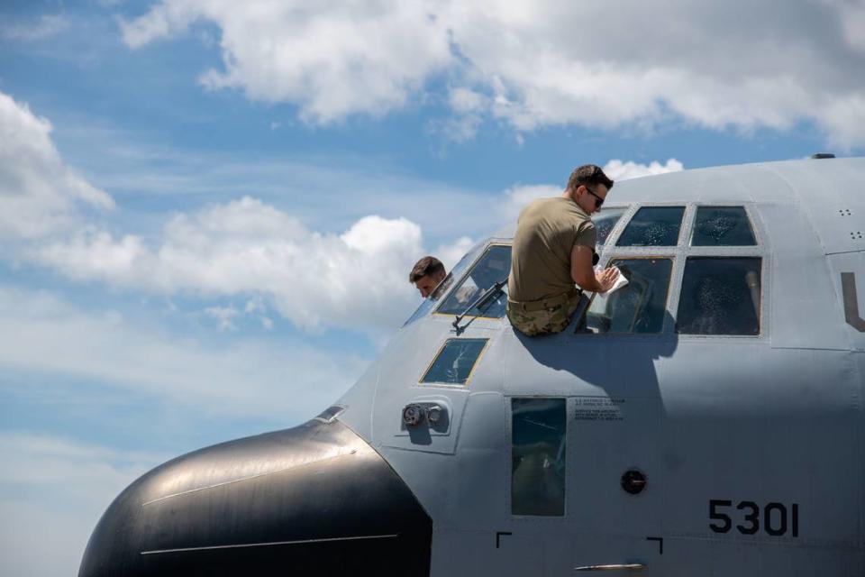 Members of the 403rd Aircraft Maintenance Squadron at Keesler Air Force Base in Biloxi tend to a WC-130J assigned to the 53rd Weather Reconnaissance Squadron after they returned to Keesler from San Antonio Aug. 31, 2021. The squadron evacuated from Keesler ahead of Hurricane Ida’s landfall.