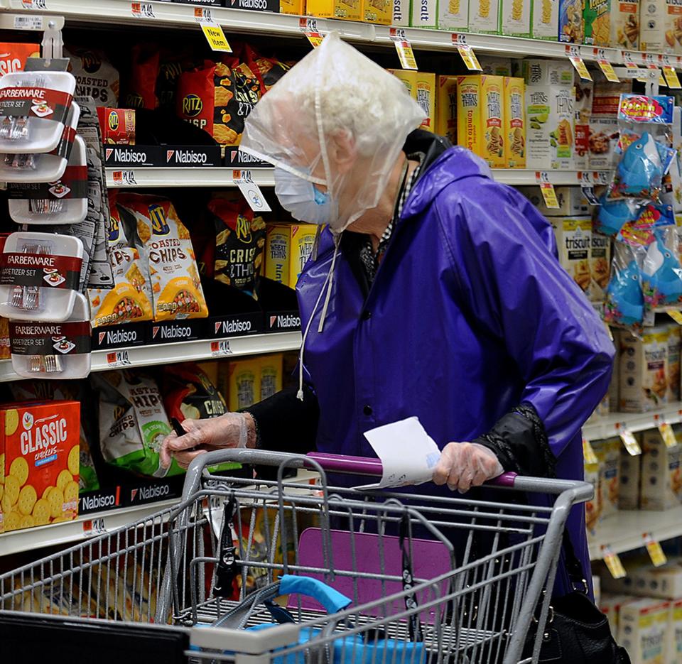 At the Old Connecticut Path Stop and Shop in Framingham, Eleanor Leach, of Framingham, wearing gloves and a mask, shopped at 6:45 a.m., after the supermarket chain began early hours for senior and at-risk customers, March 19, 2020.