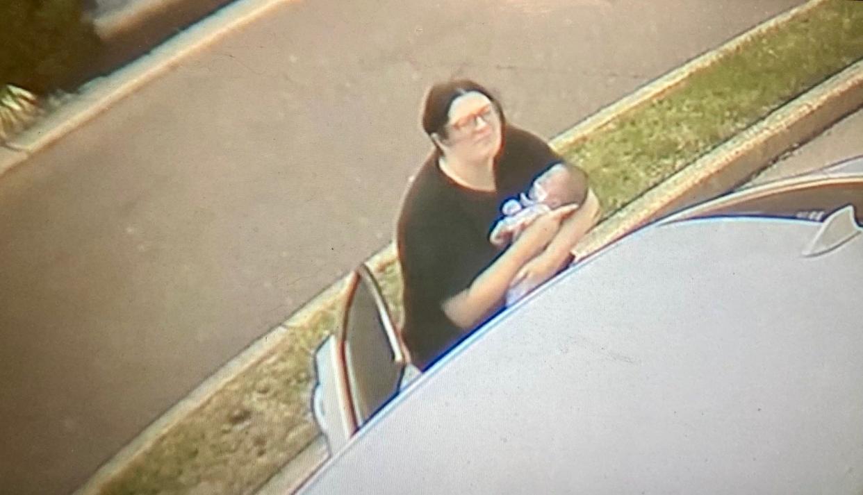 This screen shot from a surveillance video shows Natasha Long holding her 11-week-old son Myles when he stopped breathing when she was in the drive-thru line at a Taco Bell in Richboro on April 13, 2024. A quick thinking manager performed CPR and saved the baby