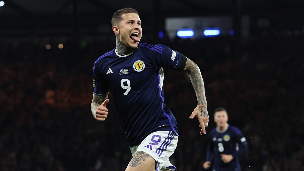   Lyndon Dykes of Scotland celebrates scoring ahead of this weekend's Euro 2024 qualifier against Norway. 