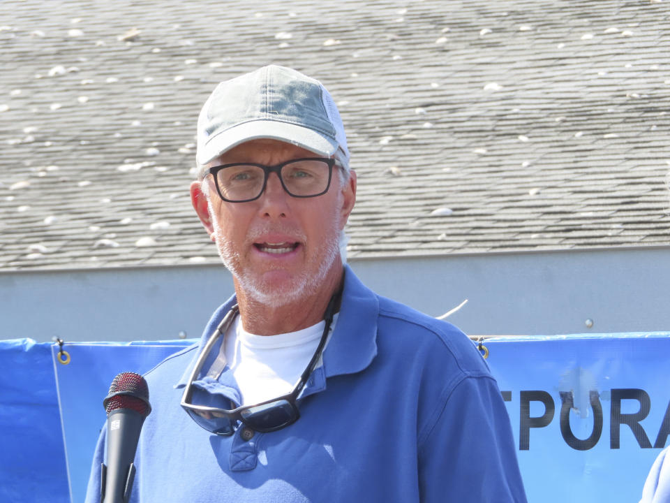 Keith Craffey, president of the Baymen's Protective Association on New Jersey's Raritan Bay, discusses the seafood industry at a clam processing plant in Highlands, N.J., on Aug. 1, 2023. The commercial and recreational fishing industry has numerous concerns over offshore wind projects. The wind industry says it has tried to address those concerns, and will pay compensation for those that can't be avoided. (AP Photo/Wayne Parry)