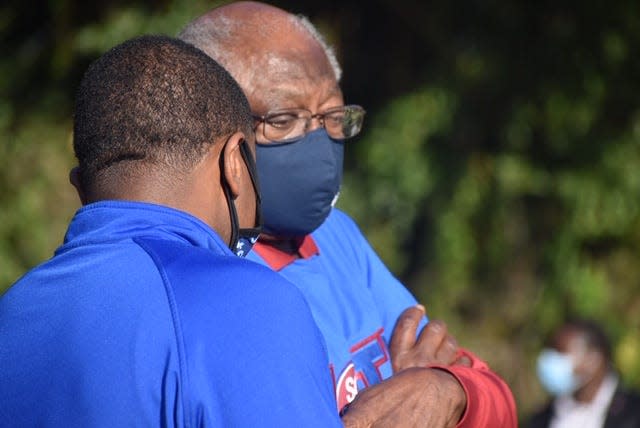 South Carolina Rep. James Clyburn huddled to discuss strategies with his political advisor Antjuan Seawright at a campaign rally Nov. 1, 20202 in North Charleston.