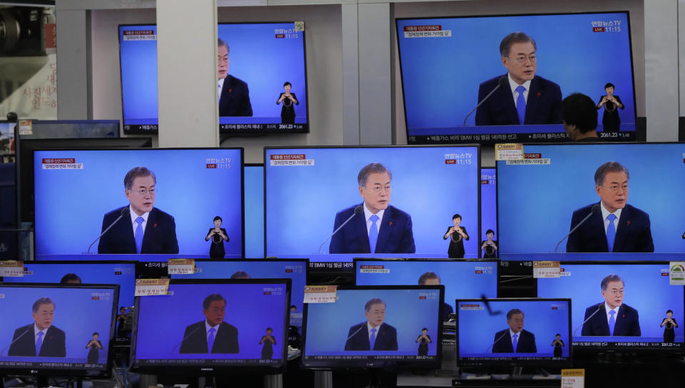 TV screens show the live broadcast of South Korean President Moon Jae-in's New Year press conference at an electronic shop in Seoul, South Korea, Thursday, Jan. 10, 2019. President Moon suggested Thursday that he'll push for sanction exemptions to restart dormant economic cooperation projects with North Korea.(AP Photo/Lee Jin-man)