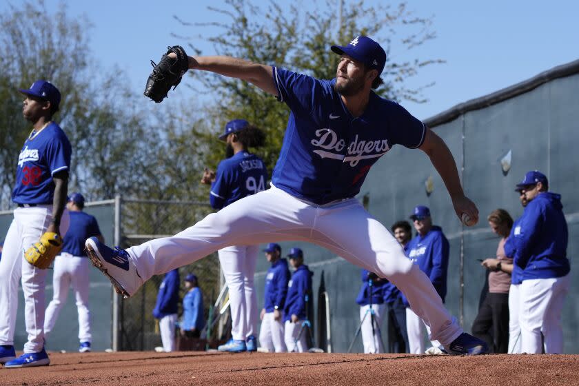 Los Angeles Dodgers starting pitcher Clayton Kershaw throws a pitch during the first day of spring training.