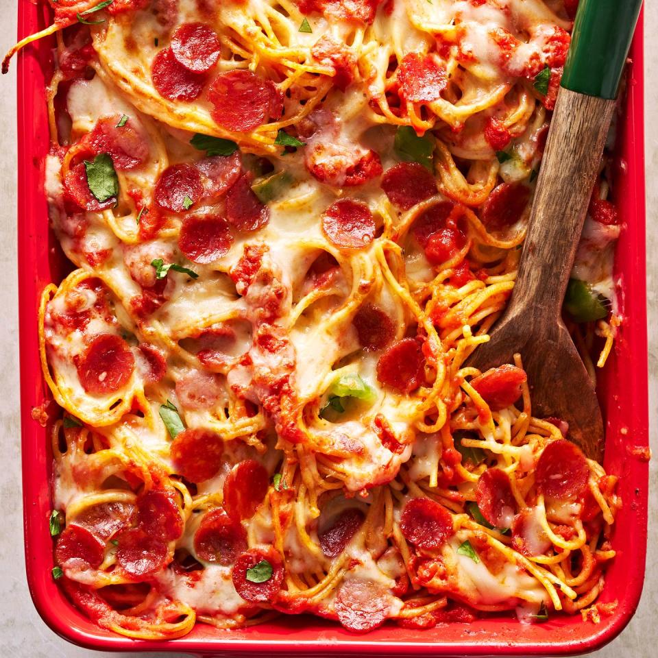 pizza spaghetti with cheese and pepperoni in a baking dish