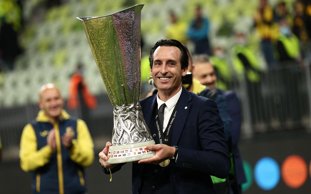 Villarreal's Spanish coach Unai Emery celebrates with the trophy after winning during the UEFA Europa League final football match between Villarreal CF and Manchester United at the Gdansk Stadium