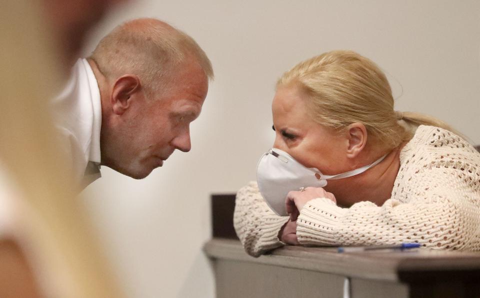 James Pente talks with his fiancé Tammy Sytch, as she leans on the partition between the gallery and the defense table, Friday, May 13, 2022, before a bond hearing for a drunk driving causing death charge.