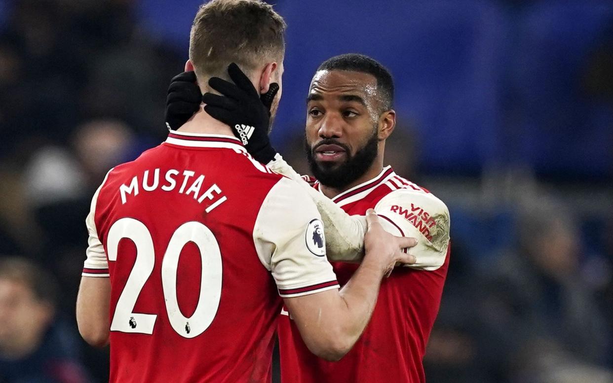 Alexandre Lacazette congratulates Shkodran Mustafi on his second-half performance - REX