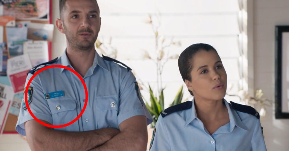 Kirsty Marillier as Rose Delaney with a police officer on Home and Away