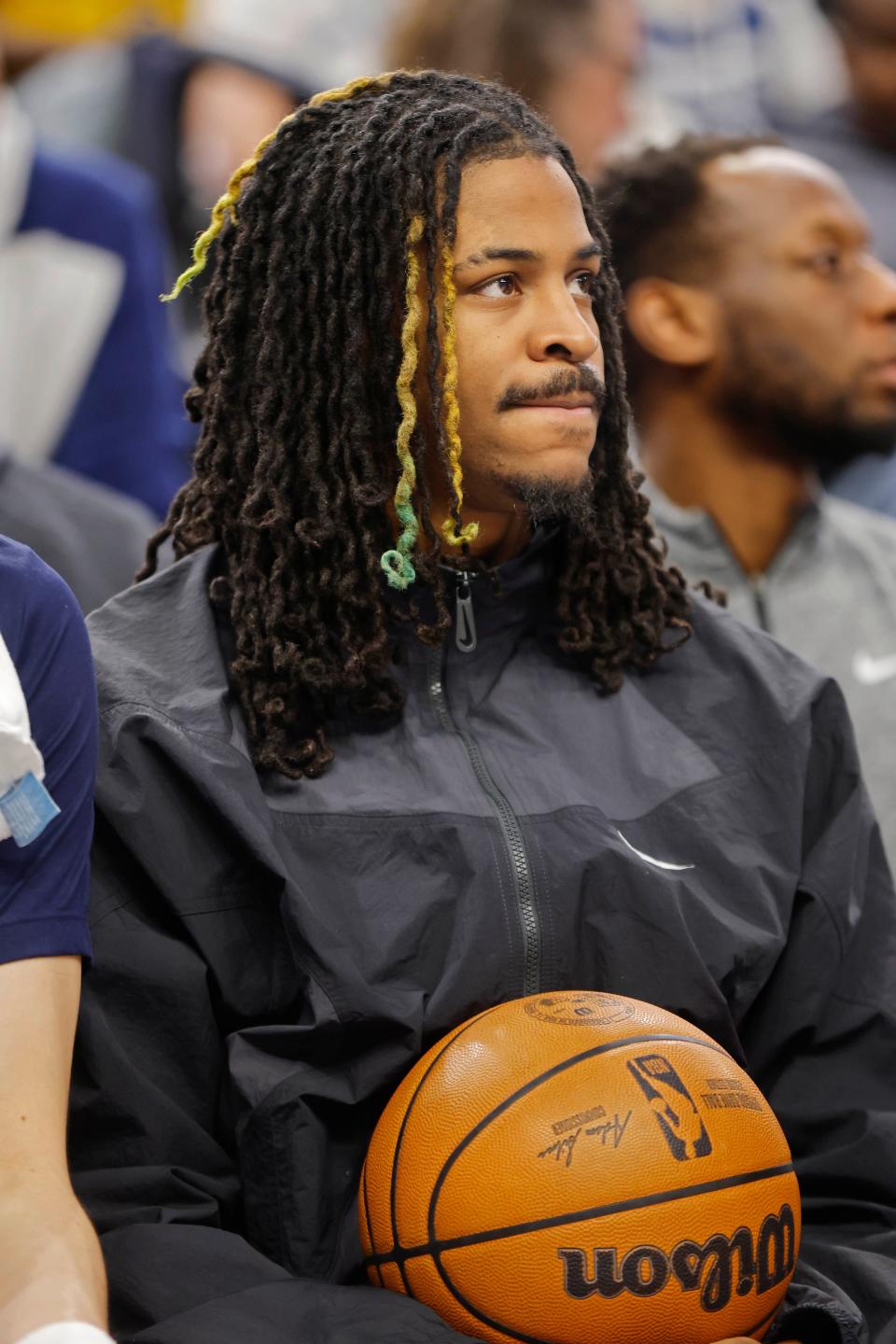 Memphis Grizzlies guard Ja Morant (12) watches as his team plays the Minnesota Timberwolves in the fourth quarter at Target Center.