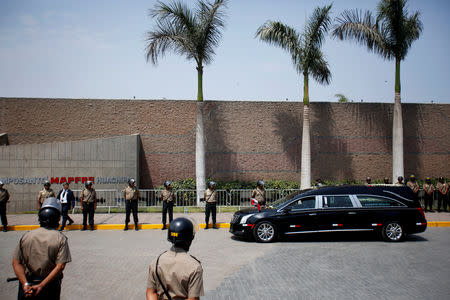 The hearse carrying the remains of Peru's former President Alan Garcia, who killed himself this week, arrives at the Mapfre Cemetery, in Lima, Peru April 19, 2019. REUTERS/Janine Costa