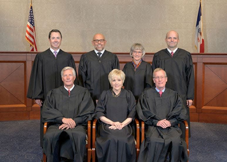 The justices of the Iowa Supreme Court. Front row, from left, Justice Thomas Waterman, Chief Justice Susan Christensen, and Justice Edward Mansfield; back row from left, Justice Matthew McDermott, Justice Christopher McDonald, Justice Dana Oxley and Justice David May.