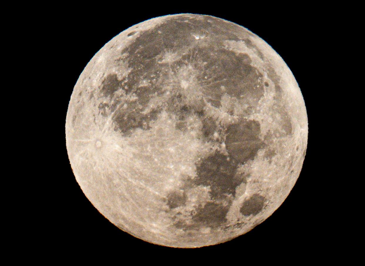 The full “harvest moon” supermoon sets over Bayside on Friday, Sept. 29, 2023.