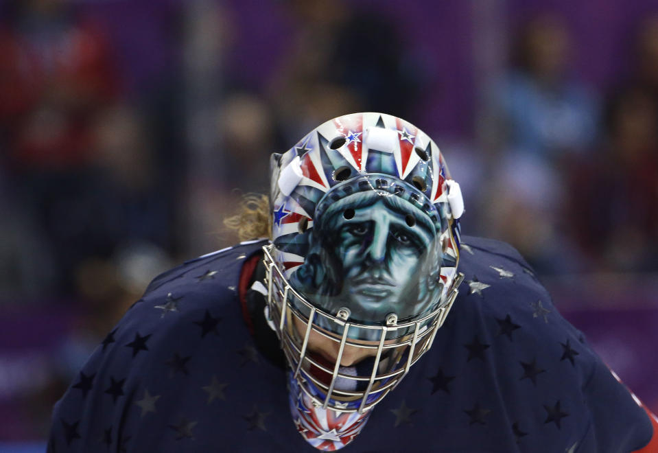 USA goalkeeper Jessie Vetter (31) looks down during a break in play during overtime of the women's gold medal ice hockey game against Canada at the 2014 Winter Olympics, Thursday, Feb. 20, 2014, in Sochi, Russia. (AP Photo/Mark Humphrey)