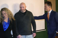 Scott Verti, center, is flanked by his attorneys, Mara Essick, left, and Kurt Zaner after a news conference at the Denver Press Club on Thursday, Jan. 19, 2023, in Denver. Verti, who says he was repeatedly sexually abused as a teenager by a Catholic priest while serving as an altar boy in a parish in Fort Collins, Colo., is suing that defrocked priest and the Archdiocese of Denver. (AP Photo/David Zalubowski)