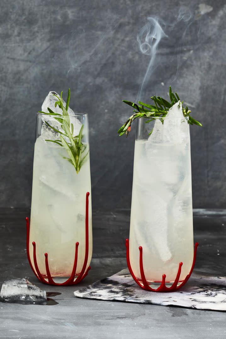 <p>A sprig of smoldering rosemary completes this sweet-sour cocktail.</p><p>Get the <a href="https://www.goodhousekeeping.com/food-recipes/a37116577/rosemary-gin-gimlet-recipe/" rel="nofollow noopener" target="_blank" data-ylk="slk:Rosemary Gin Gimlet recipe;elm:context_link;itc:0;sec:content-canvas" class="link "><strong>Rosemary Gin Gimlet recipe</strong></a>.</p>