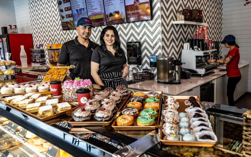 Lisy Zambrana y Relvis Diaz, owners of the new Vicky Bakery, display some of the many pastries available at the store, located at 8290 Bird Rd, in Miami, on Wednesday May 10 , 2023.