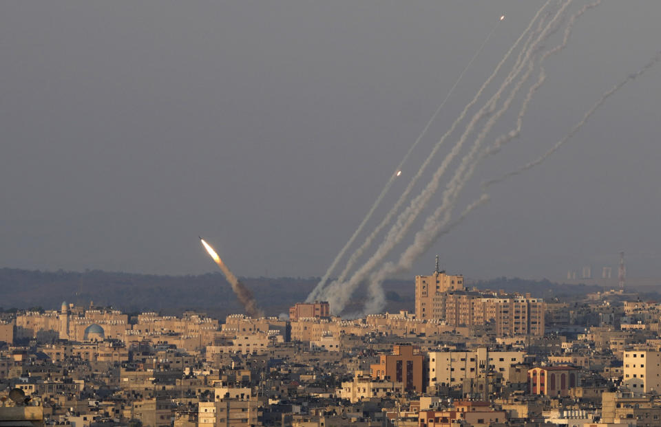 Rockets are launched from the Gaza Strip towards Israel, in Gaza City, Sunday, Aug. 7, 2022. (AP Photo/Hatem Moussa)