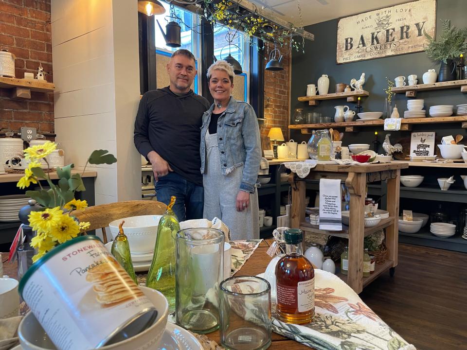 Sarah and Steve Davey pose for a photo in their new shop, Simply Home, in downtown Howell.