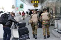Belgian soldiers patrol at Zaventem international airport near Brussels, November 22, 2015, after security was tightened in Belgium following the fatal attacks in Paris. REUTERS/Francois Lenoir
