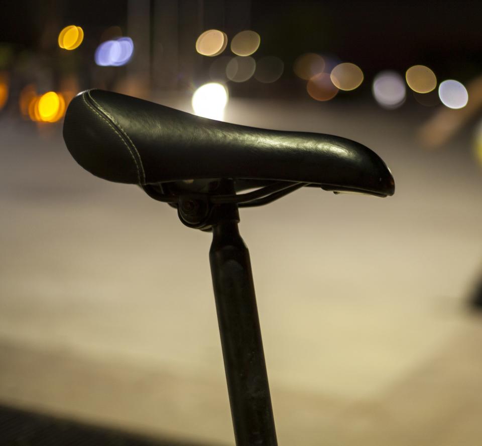 bike seat at night with blurry lights