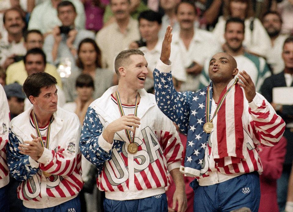 FILE - USA's John Stockton, from left, Chris Mullin, and Charles Barkley rejoice with their gold medals after beating Croatia 117-85 in the gold medal game in men's basketball at the Summer Olympics in Barcelona on Aug. 8, 1992. (AP Photo/John Gaps III, File)