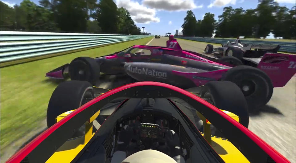 In this image taken from a video provided by iRacing IndyCar, IndyCar driver Kyle Kirkwood, foreground, collides with Alexander Rossi (27) during the early running of the American Red Cross Grand Prix virtual IndyCar auto race at Watkins Glen International, Saturday, March 28, 2020. (iRacing IndyCar via AP)