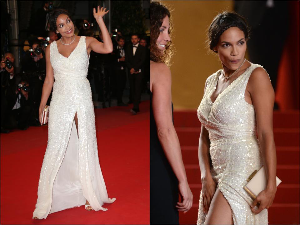 Side by side of Rosario in a white sequin gown with a leg slit in the middle that exposes a lot of her leg as she walks. She holds down the fabric by her crotch and makes a funny face.