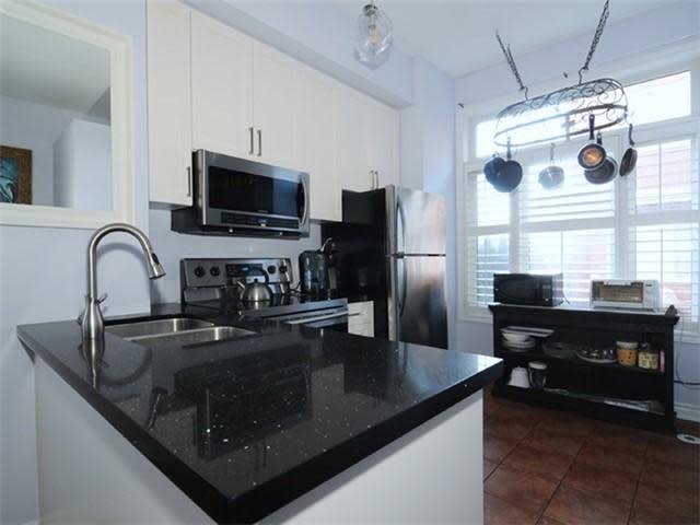 <p><a rel="nofollow noopener" href="https://www.zoocasa.com/toronto-on-real-estate/5066511-16-old-primrose-lane-toronto-on-m5a4t1-c4035248" target="_blank" data-ylk="slk:16 Old Primrose Lane, Toronto, Ont.;elm:context_link;itc:0;sec:content-canvas" class="link ">16 Old Primrose Lane, Toronto, Ont.</a><br> It comes with a new stainless steel fridge, stove, dishwasher and microwave.<br> (Photo: Zoocasa) </p>