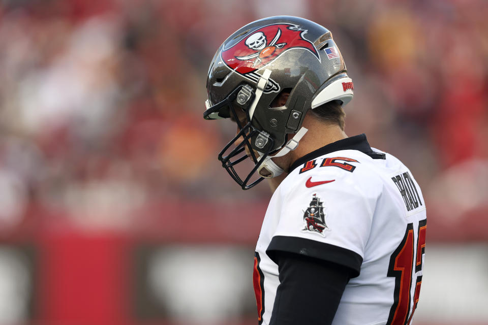 Tampa Bay Buccaneers quarterback Tom Brady (12) walks off the field after a drive stalled during the second half of an NFL divisional round playoff football game against the Los Angeles Rams Sunday, Jan. 23, 2022, in Tampa, Fla. (AP Photo/Mark LoMoglio)