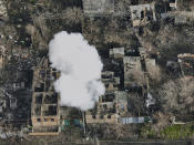 FILE Smoke billows after Russian attacks in the outskirts of Bakhmut, Ukraine, Tuesday, Dec. 27, 2022. (AP Photo/LIBKOS, File)