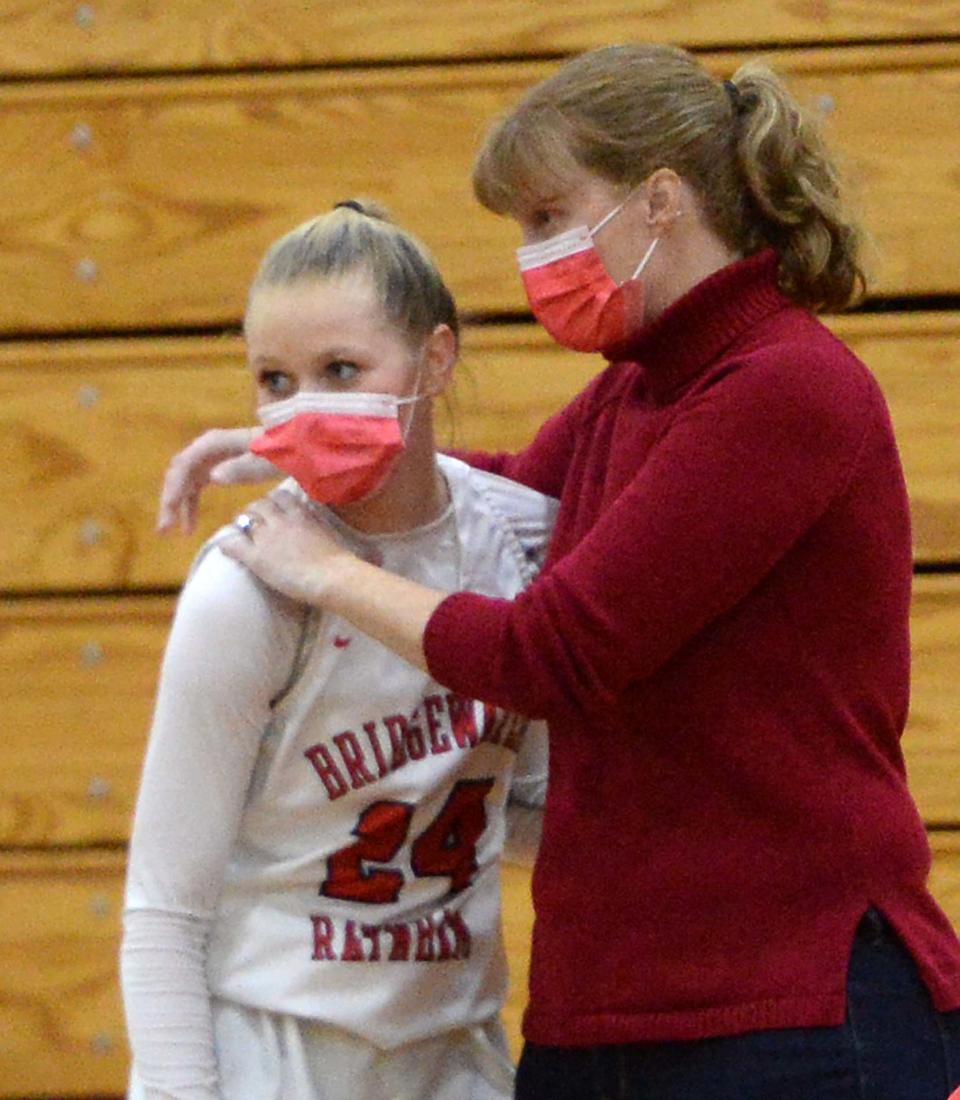 Bridgewater-Raynham's Cheryl Seavey, congratulates Kenzie Matulonis, during a game on Tuesday, Feb. 9, 2021.