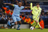 Football - Manchester City v FC Barcelona - UEFA Champions League Second Round First Leg - Etihad Stadium, Manchester, England - 24/2/15 Manchester City's Vincent Kompany in action with Barcelona's Lionel Messi Action Images via Reuters / Jason Cairnduff Livepic EDITORIAL USE ONLY.