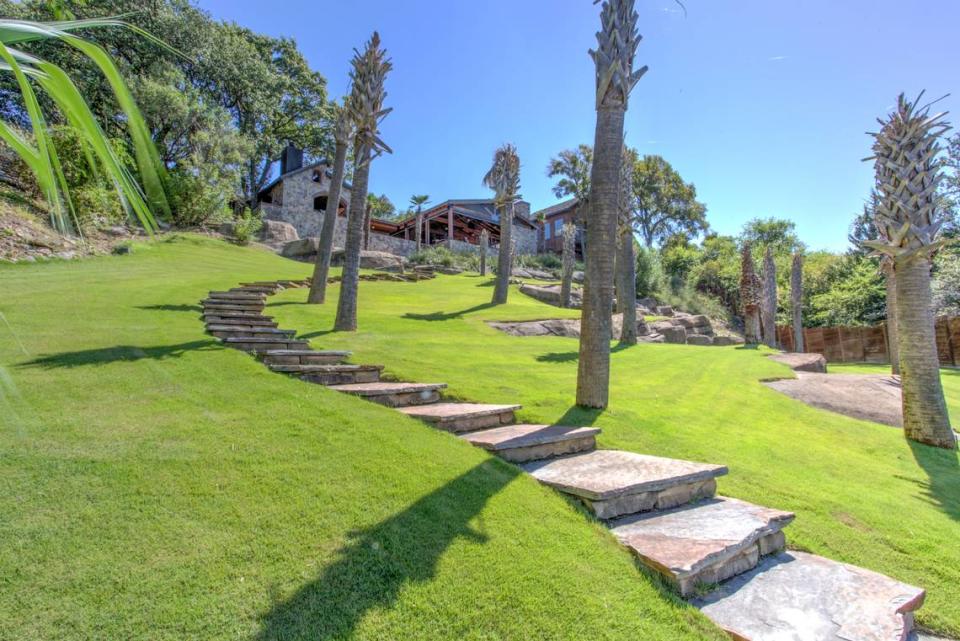 A terraced concrete stairway leads down to a boat dock.