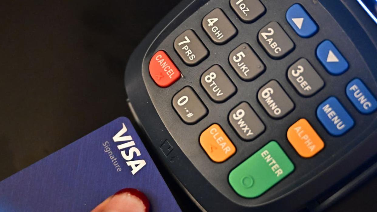 <div>A credit card is placed into a credit card machine for processing payments on September 11, 2023 in La Puente, California. Credit card debt from US consumers is rising by billions of dollars amid higher inflation and interest rates, topping $1 trillion for the first time in history, according to the Federal Reserve Bank of New York. (Photo by Frederic J. BROWN / AFP) (Photo by FREDERIC J. BROWN/AFP via Getty Images)</div>