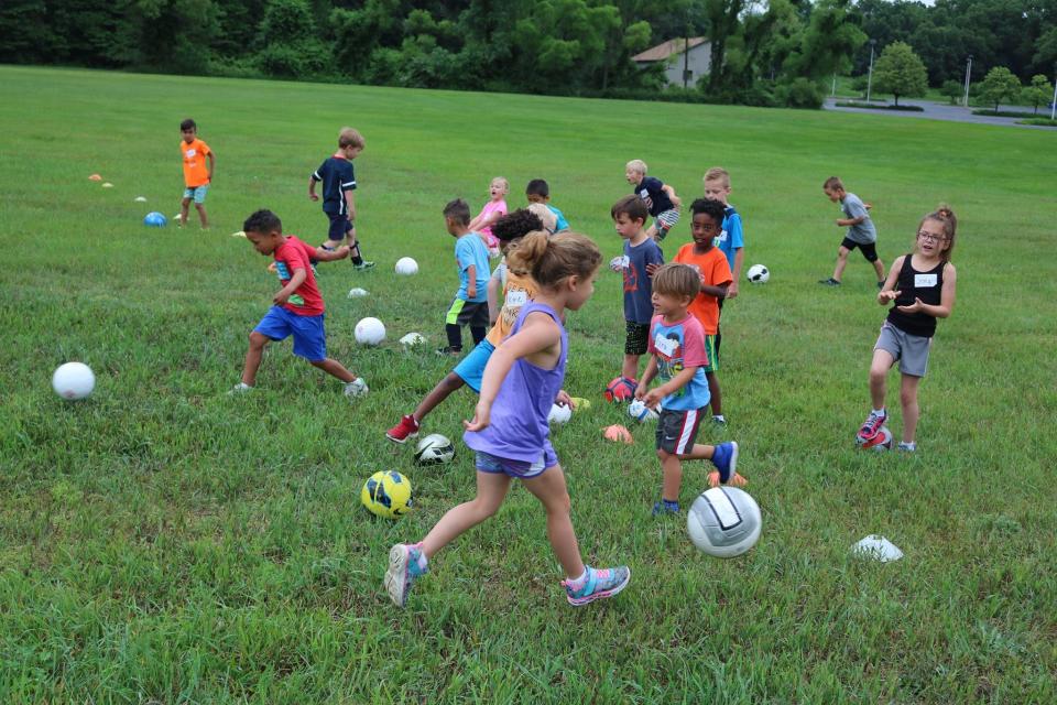 Children play outdoors at Beechwood Church in Holland. The church used outdoor space to build community in the wake of the COVID-19 pandemic.