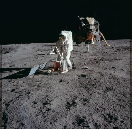 Astronaut Edwin E. Aldrin Jr., lunar module pilot, deploys a scientific research package on the surface of the moon near the Lunar Module (LM) "Eagle" during the Apollo 11 extravehicular activity (EVA) in this July 20, 1969 NASA handout photo. The photograph is one of more than 12,000 from NASA's archives recently aggregated on the Project Apollo Archive Flickr account. REUTERS/NASA/Handout via Reuters