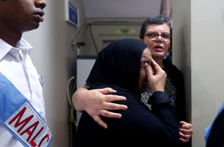 People comfort each other during the funeral of the German-born Sister Dr. Ruth Pfau, at the Marie Adelaide Leprosy Centre (MALC) in Karachi, Pakistan August 19, 2017. REUTERS/Akhtar Soomro