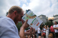 <p>A man checks out the total solar eclipse using a cereal box in Union Square, New York City, on Aug. 21, 2017. (Gordon Donovan/Yahoo News) </p>