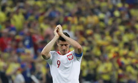 Soccer Football - World Cup - Group H - Poland vs Colombia - Kazan Arena, Kazan, Russia - June 24, 2018 Poland's Robert Lewandowski looks dejected as he applauds the fans at the end of the match REUTERS/Toru Hanai