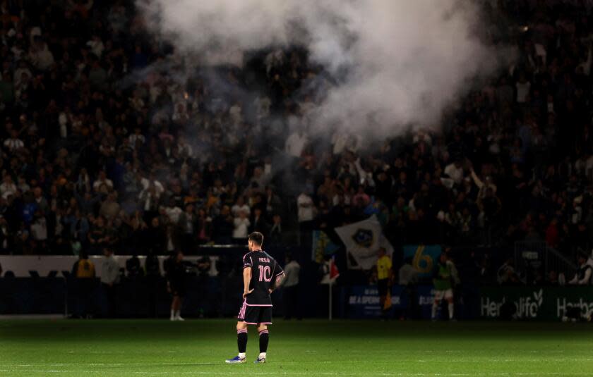 Inter Miami's Lionel Messi watches as the Galaxy celebrate scoring a goal at Dignity Health Sport Park Sunday.