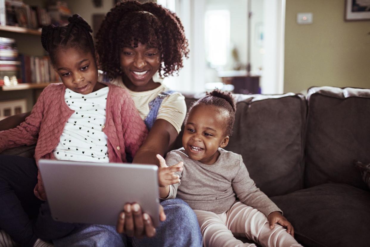 Mother and children watching video on tablet