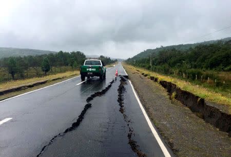 A damaged road is seen after a quake hit Chiloe island, southern Chile, December 25, 2016. REUTERS/Stringer