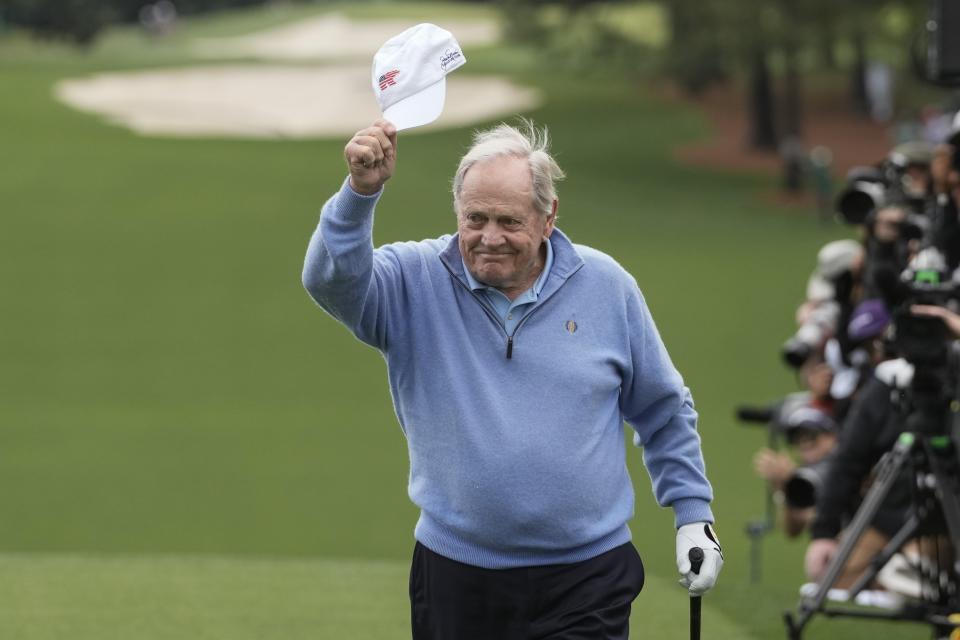 Honorary starter Jack Nicklaus waves as he arrives for his ceremonial tee shot on the first hole during the first round at the Masters golf tournament at Augusta National Golf Club Thursday, April 11, 2024, in Augusta, Ga. (AP Photo/Charlie Riedel)