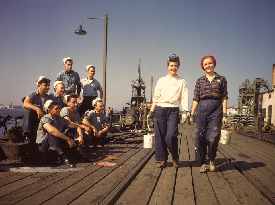 In 1943, sailors admire women workers at the Electric Boat Co. in New London, Conn., where submarines were built during World War II. (Photo: Bernard Hoffman/Getty Images)