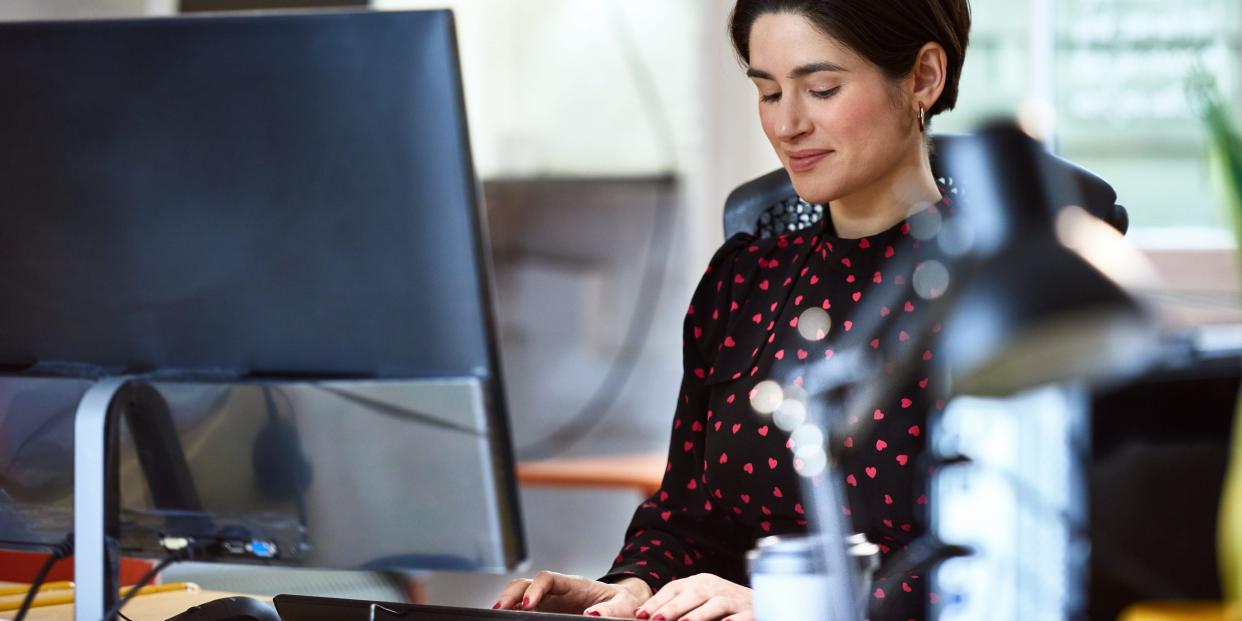 woman using desktop computer