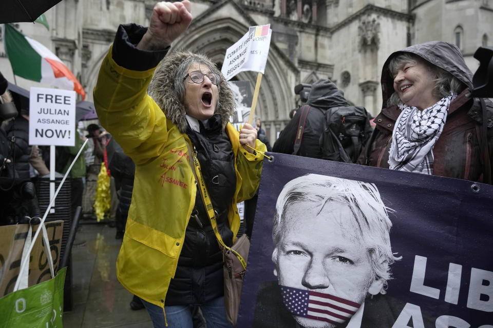 Protesters shout outside the Royal Courts of Justice in London, Wednesday, Feb. 21, 2024. Julian Assange's lawyers are on their final U.K. legal challenge to stop the WikiLeaks founder from being sent to the United States to face spying charges. The 52-year-old has been fighting extradition for more than a decade, including seven years in self-exile in the Ecuadorian Embassy in London and the last five years in a high-security prison. (AP Photo/Kin Cheung)